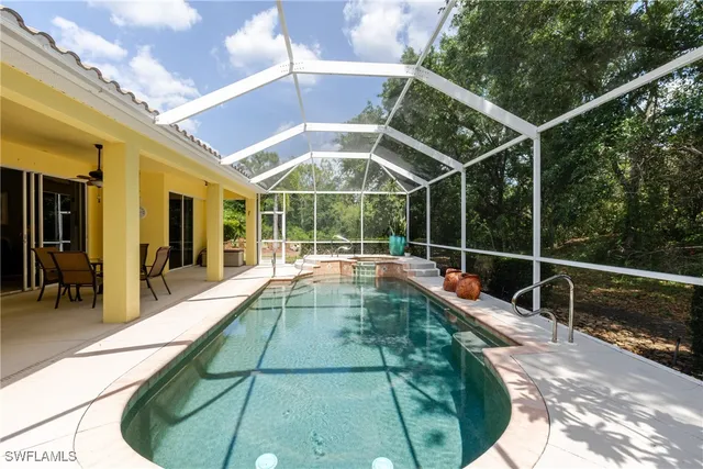 a view of a swimming pool with a porch