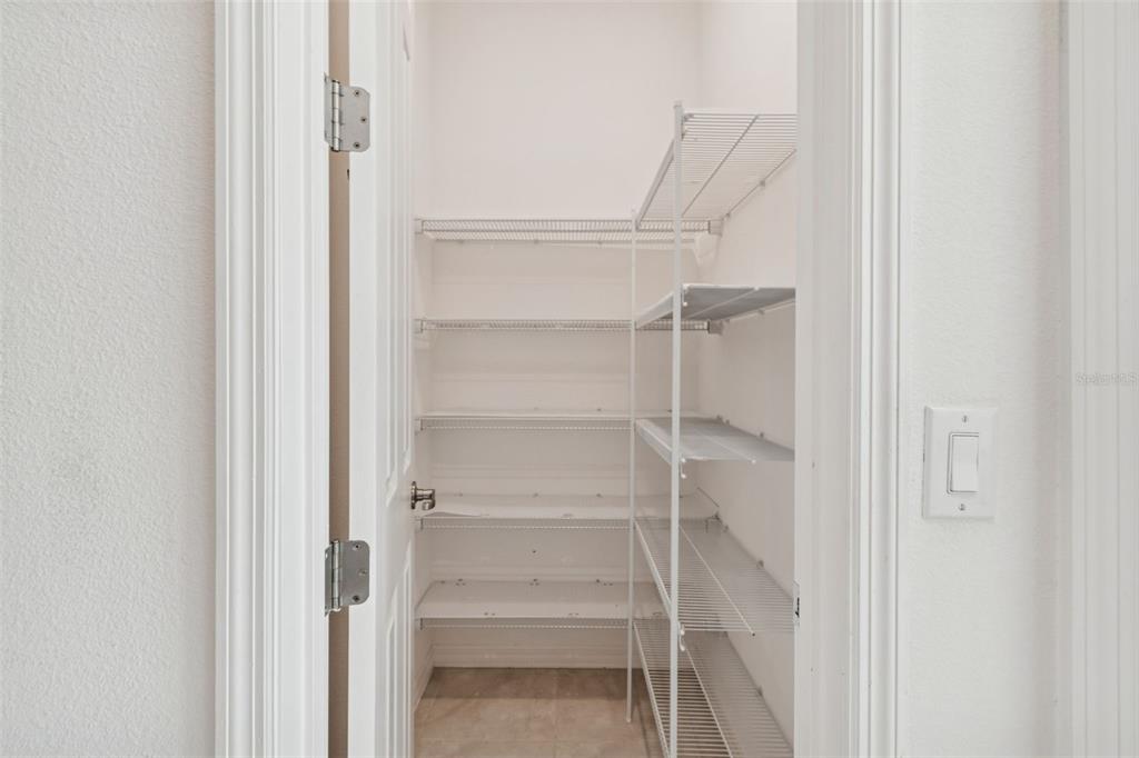 711 San Joaquin Road Kissimmee, FL 34759 - Photo 11 of 41 a view of walk in closet with empty racks