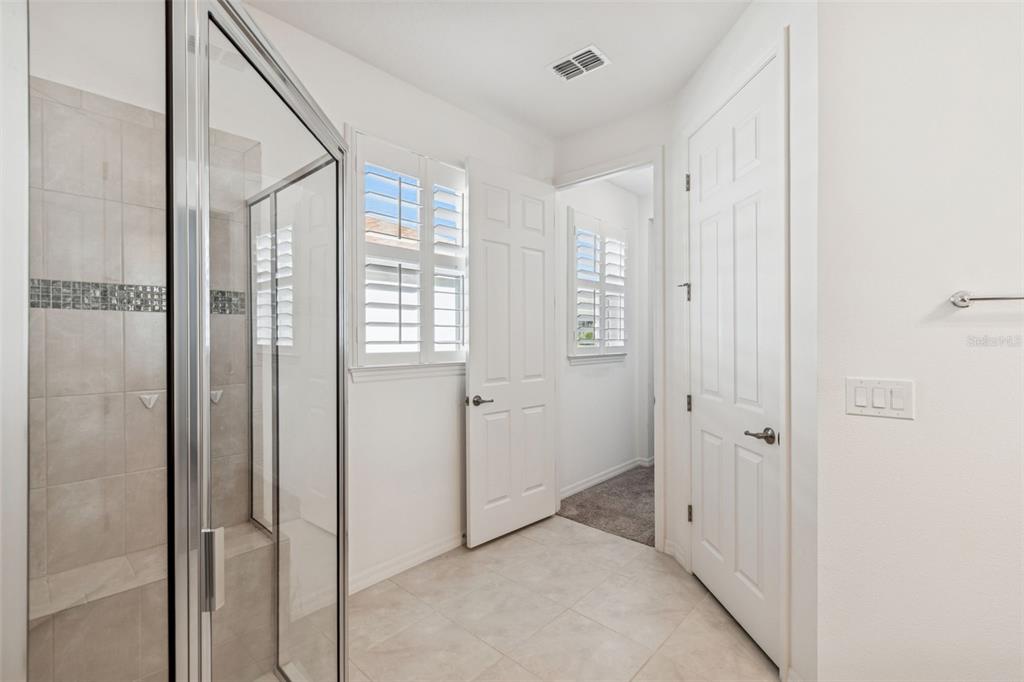711 San Joaquin Road Kissimmee, FL 34759 - Photo 16 of 41 a view of a bathroom with a shower and closet