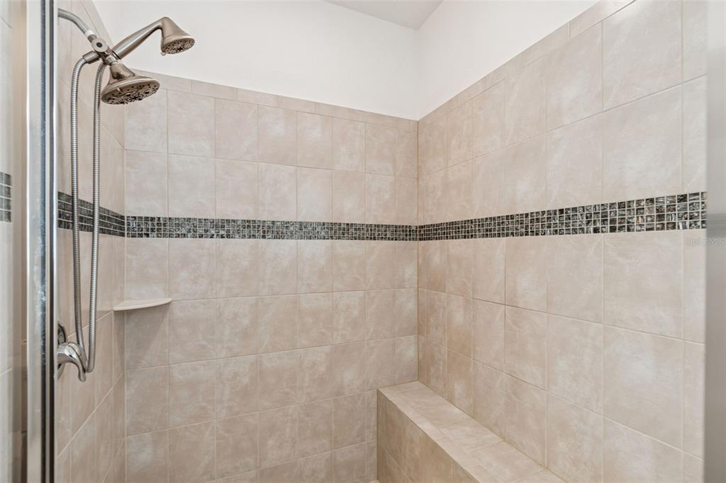711 San Joaquin Road Kissimmee, FL 34759 - Photo 17 of 41 a bathroom with a shower and a mirror