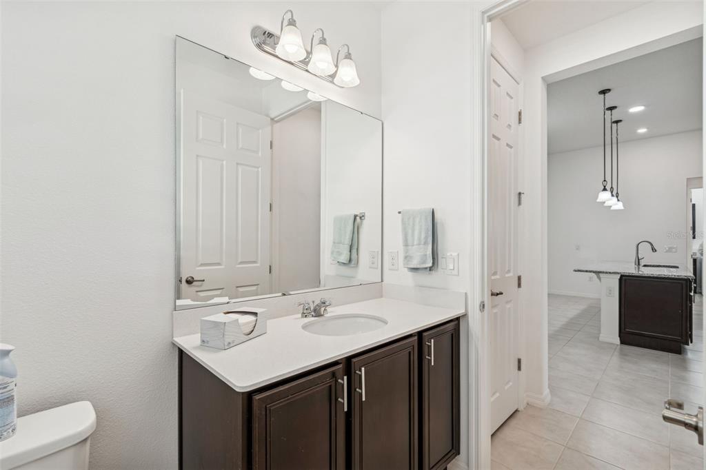 711 San Joaquin Road Kissimmee, FL 34759 - Photo 19 of 41 a bathroom with a sink a toilet and shower