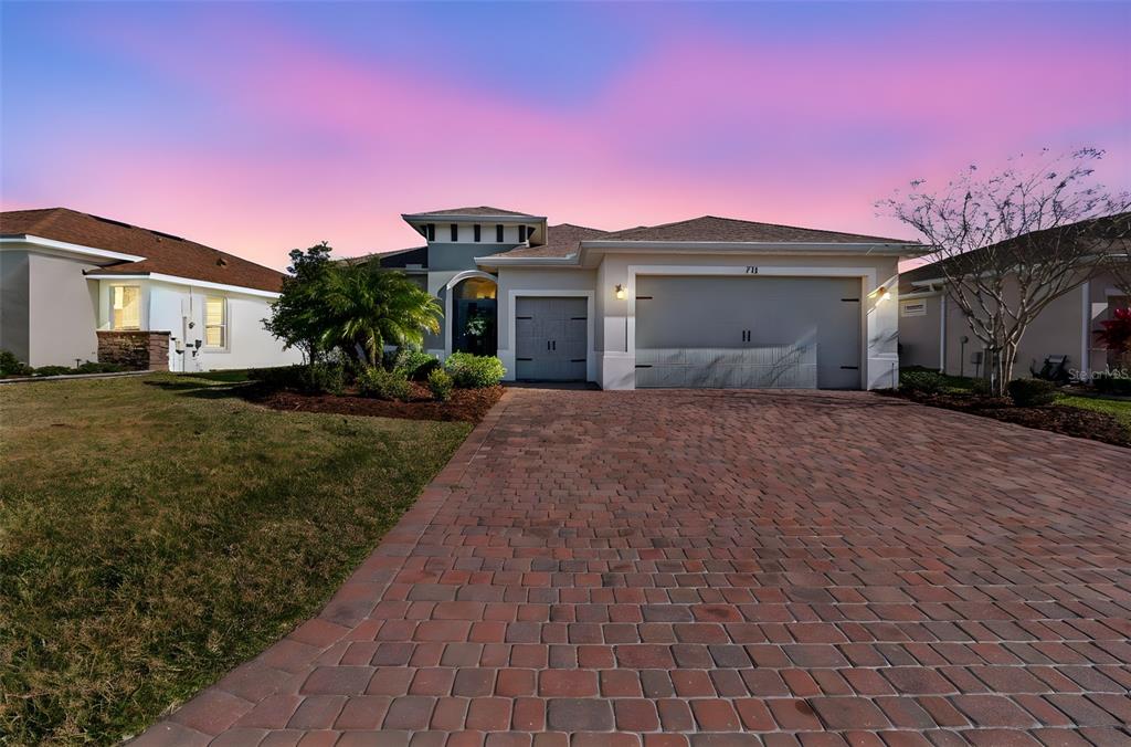 711 San Joaquin Road Kissimmee, FL 34759 - Photo 2 of 41 a view of a house with a yard