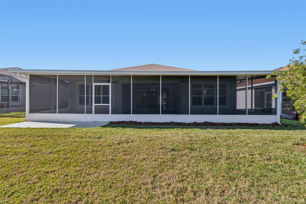 711 San Joaquin Road Kissimmee, FL 34759 - Photo 22 of 41 a view of a house with a garden