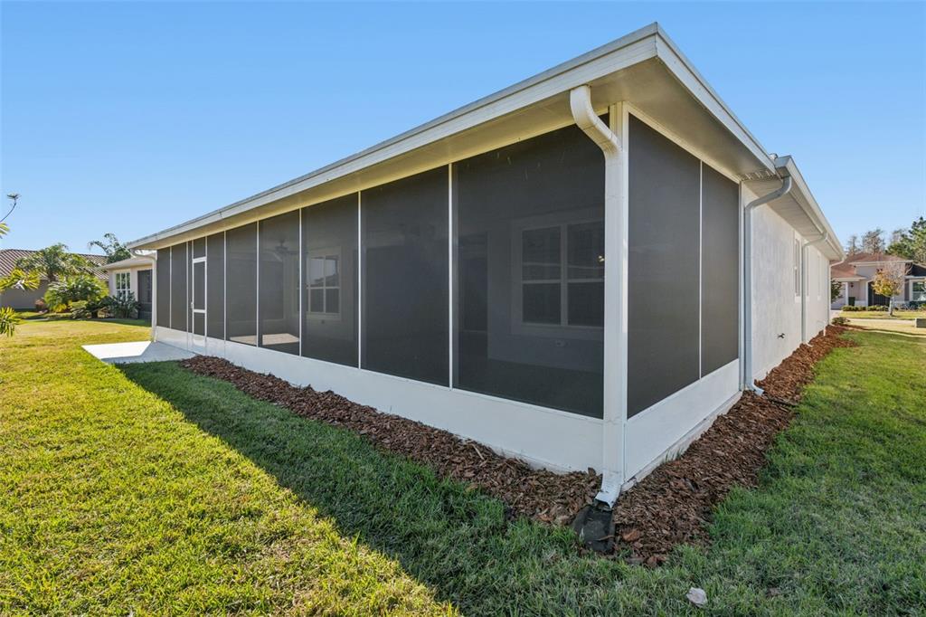 711 San Joaquin Road Kissimmee, FL 34759 - Photo 24 of 41 a view of backyard with potted plants and wooden fence