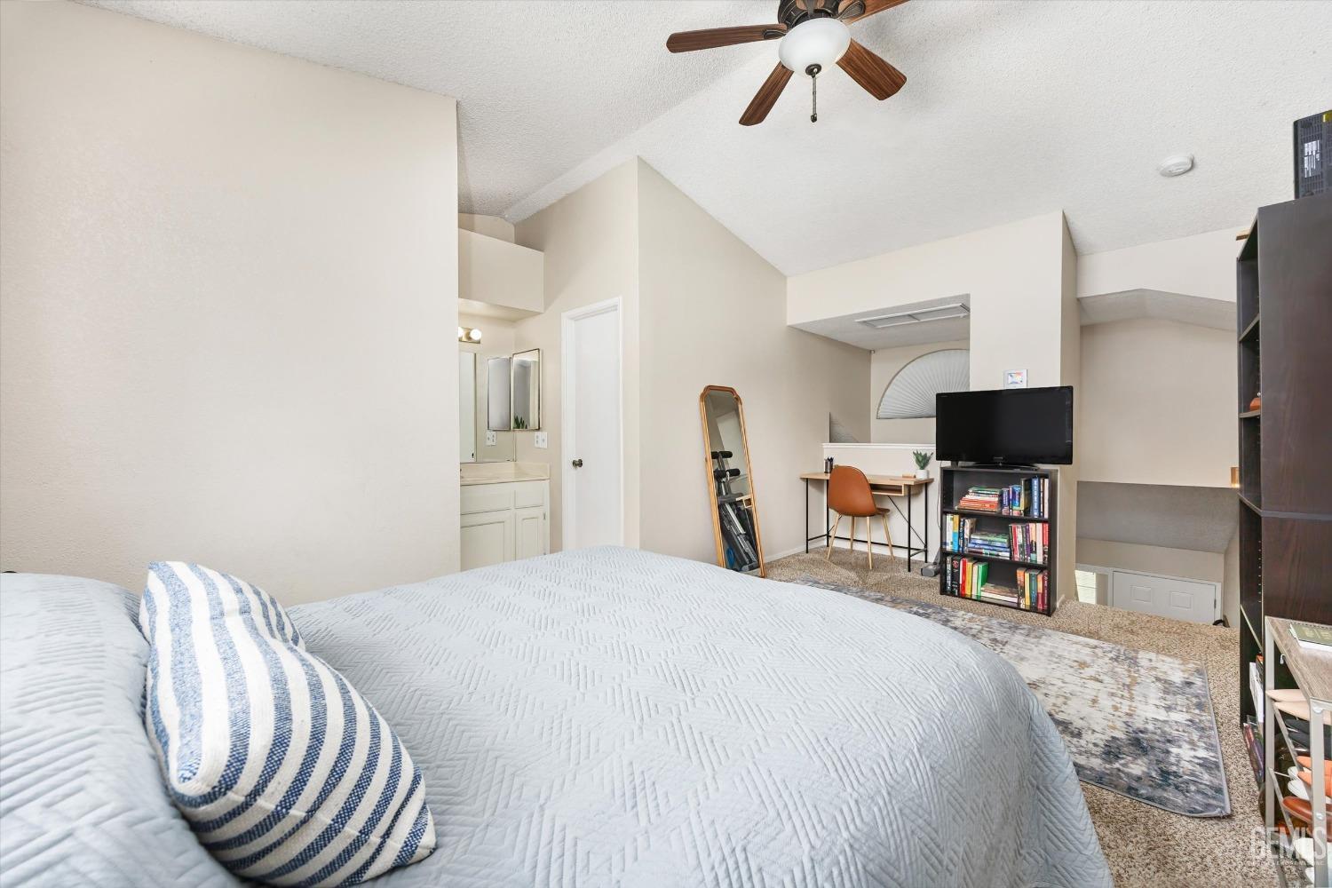 Undisclosed Address Bakersfield, CA 93311 - Photo 16 of 33 a bedroom with a bed and a flat screen tv