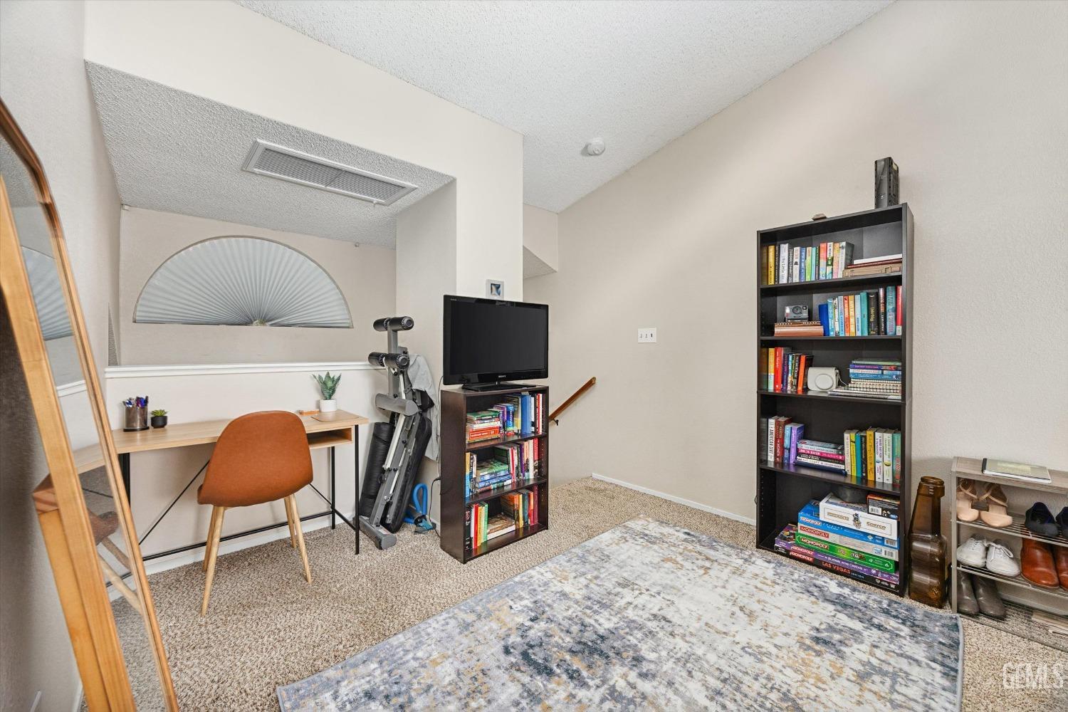 Undisclosed Address Bakersfield, CA 93311 - Photo 17 of 33 a living room with furniture and a flat screen tv