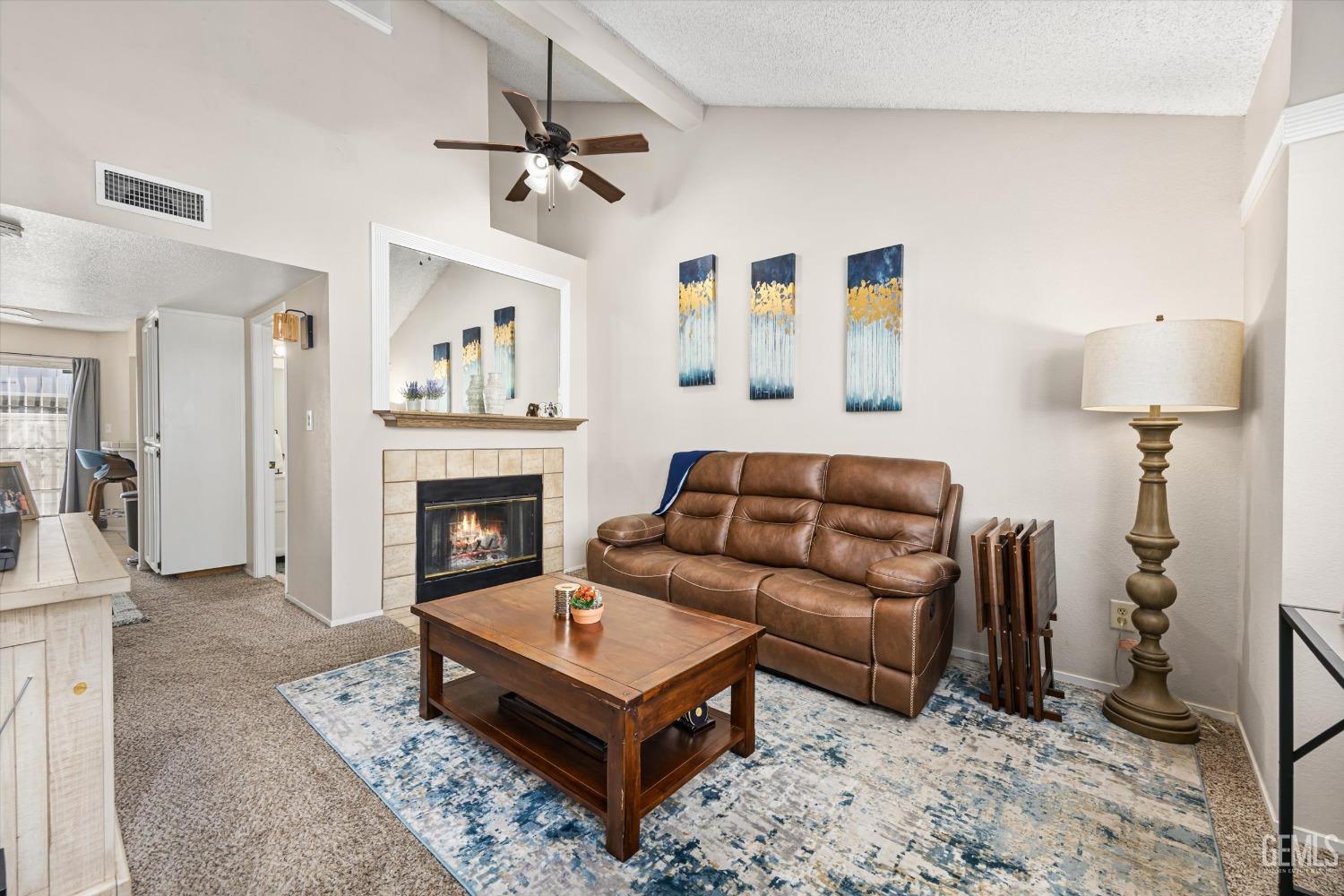 Undisclosed Address Bakersfield, CA 93311 - Photo 4 of 33 a living room with furniture a window and a fireplace