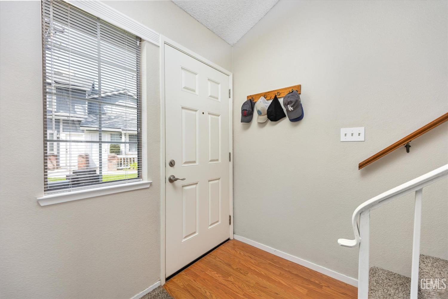 Undisclosed Address Bakersfield, CA 93311 - Photo 5 of 33 a view of a room that has a window and wooden floor