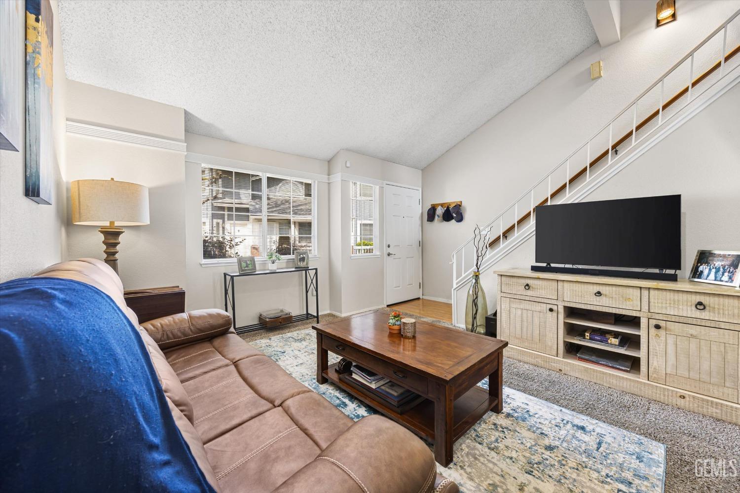 Undisclosed Address Bakersfield, CA 93311 - Photo 7 of 33 a living room with furniture and a flat screen tv