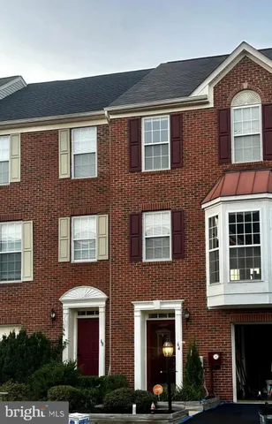 a front view of residential houses with street