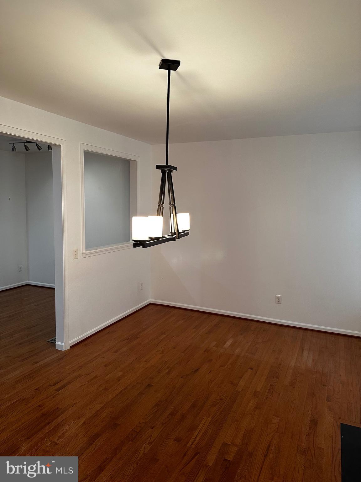 64 Monte Carlo Way Charles Town, WV 25414 - Photo 24 of 34 a view of a room with wooden floor a ceiling fan and a window