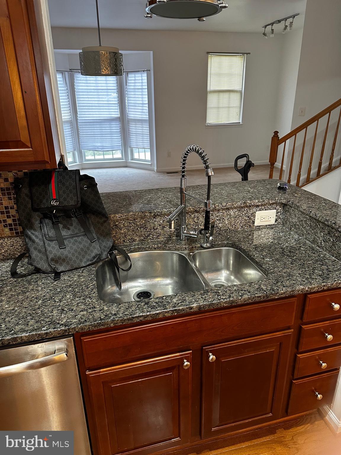 64 Monte Carlo Way Charles Town, WV 25414 - Photo 28 of 34 a kitchen with granite countertop a sink a stove and cabinets