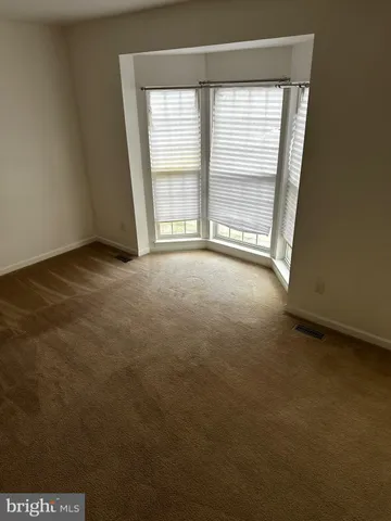 a view of a livingroom with wooden floor
