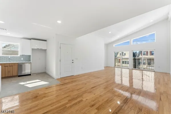 a view of a kitchen with a sink and a window