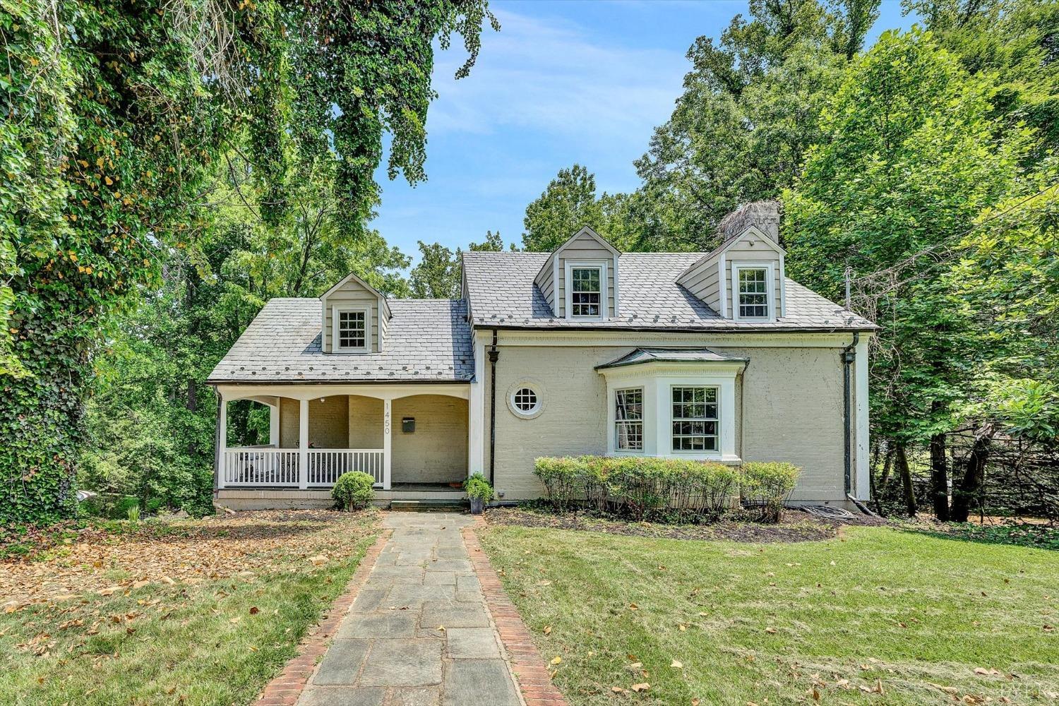 1450 Langhorne Road Lynchburg, VA 24503 - Photo 1 of 46 a front view of a house with a garden