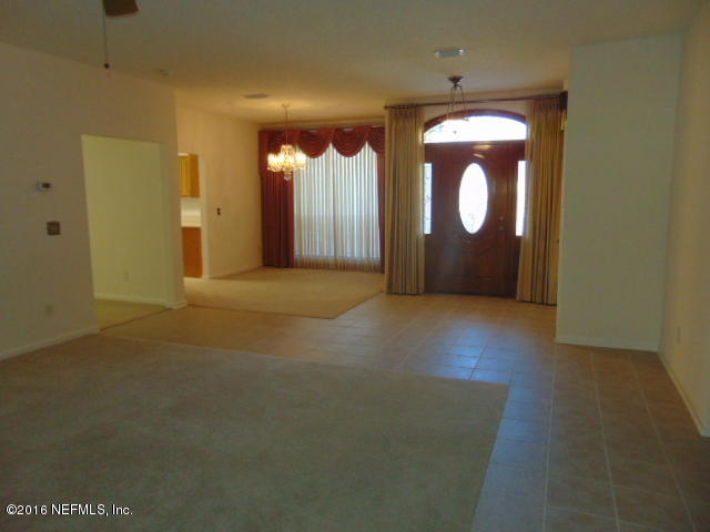 1115 Copper Field Circle Macclenny, FL 32063 - Photo 17 of 40 a view of a livingroom with a fireplace