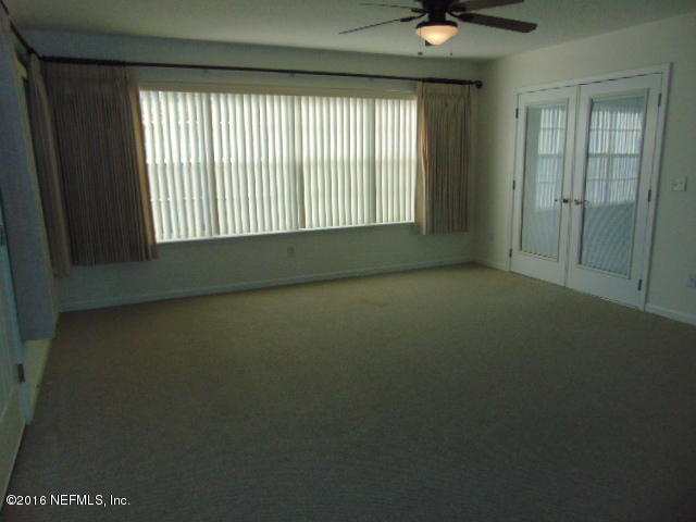 1115 Copper Field Circle Macclenny, FL 32063 - Photo 18 of 40 a view of an empty room with a window
