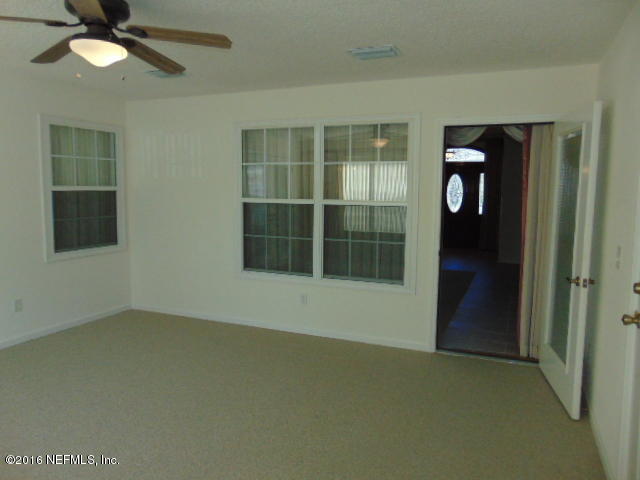 1115 Copper Field Circle Macclenny, FL 32063 - Photo 19 of 40 a view of an empty room with a window