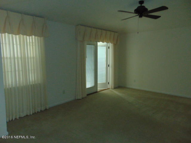 1115 Copper Field Circle Macclenny, FL 32063 - Photo 21 of 40 a view of an empty room with a window