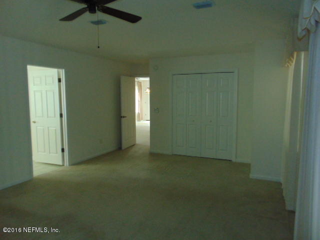 1115 Copper Field Circle Macclenny, FL 32063 - Photo 22 of 40 an empty room with a empty space and windows