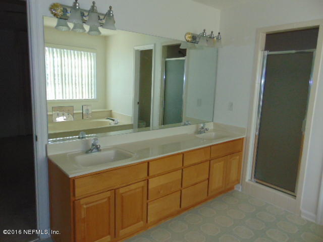 1115 Copper Field Circle Macclenny, FL 32063 - Photo 25 of 40 a bathroom with sinks mirror and double