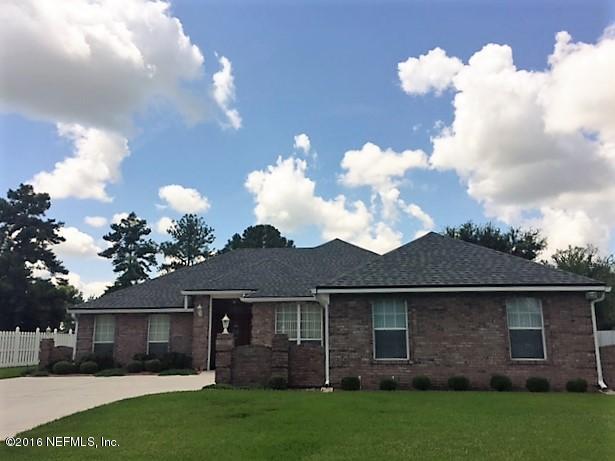 1115 Copper Field Circle Macclenny, FL 32063 - Photo 3 of 40 a view of a yard in front of house