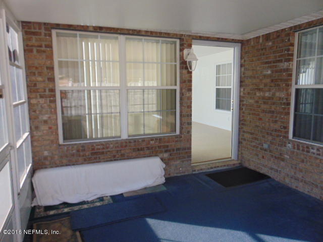 1115 Copper Field Circle Macclenny, FL 32063 - Photo 31 of 40 a bathroom with a bathtub and shower