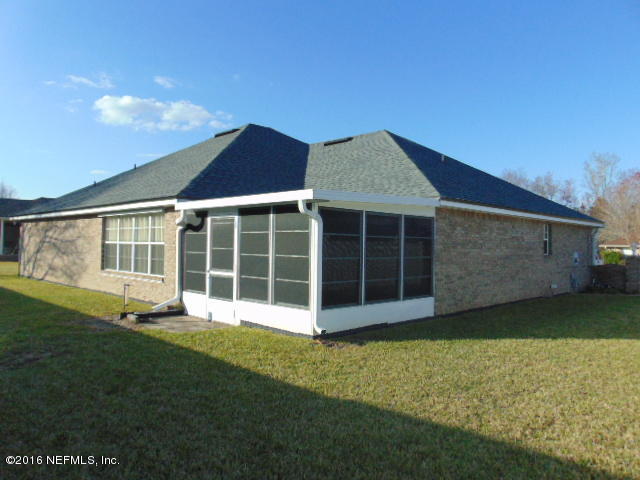 1115 Copper Field Circle Macclenny, FL 32063 - Photo 32 of 40 a view of a house with a garden
