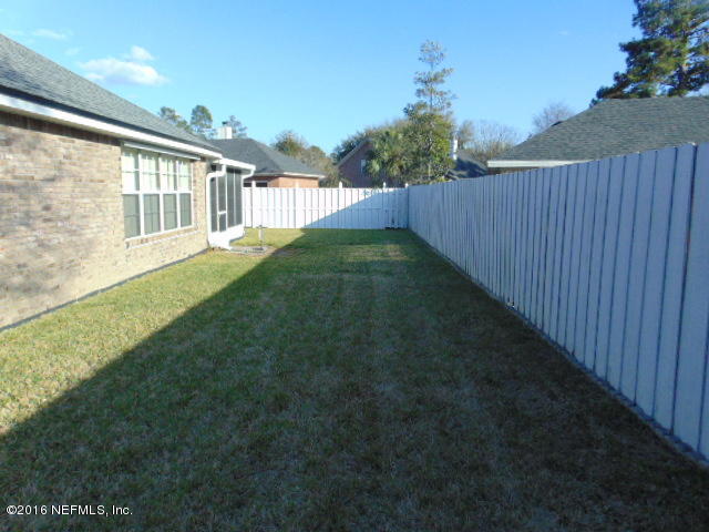 1115 Copper Field Circle Macclenny, FL 32063 - Photo 35 of 40 a view of outdoor space with deck and yard