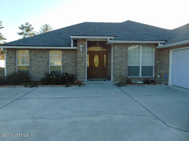 1115 Copper Field Circle Macclenny, FL 32063 - Photo 36 of 40 a front view of a house
