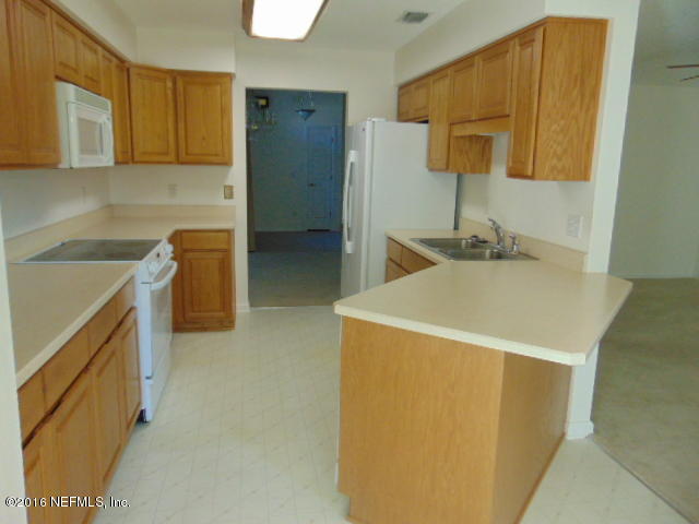 1115 Copper Field Circle Macclenny, FL 32063 - Photo 6 of 40 a utility room with two sink a washer and dryer