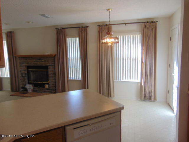 1115 Copper Field Circle Macclenny, FL 32063 - Photo 7 of 40 a view of a livingroom with a fireplace