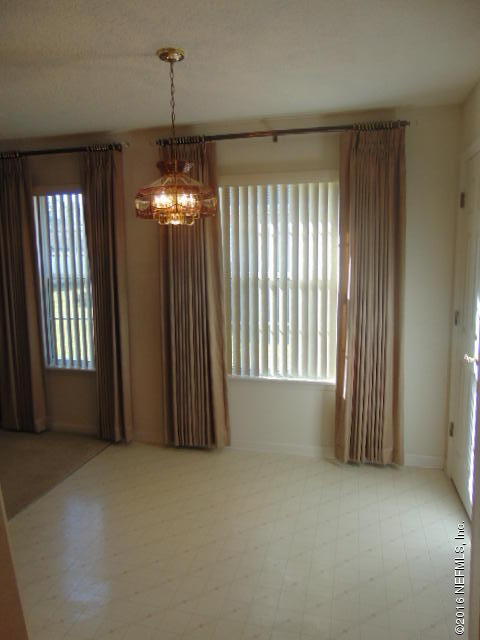 1115 Copper Field Circle Macclenny, FL 32063 - Photo 8 of 40 a view of a windows and chandelier in an empty room