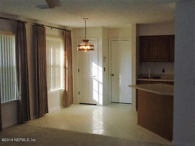 1115 Copper Field Circle Macclenny, FL 32063 - Photo 9 of 40 a view of empty room with kitchen view