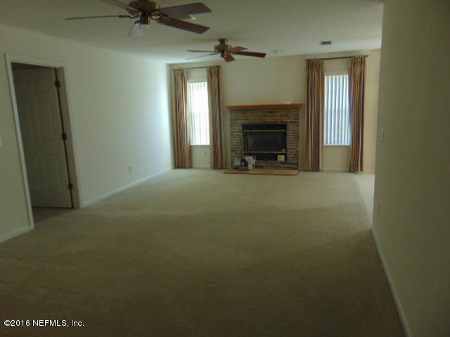 1115 Copper Field Circle Macclenny, FL 32063 - Photo 10 of 40 a view of empty room with a fireplace