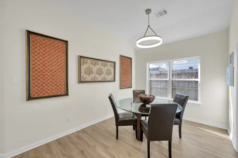 a living room with furniture and a clock