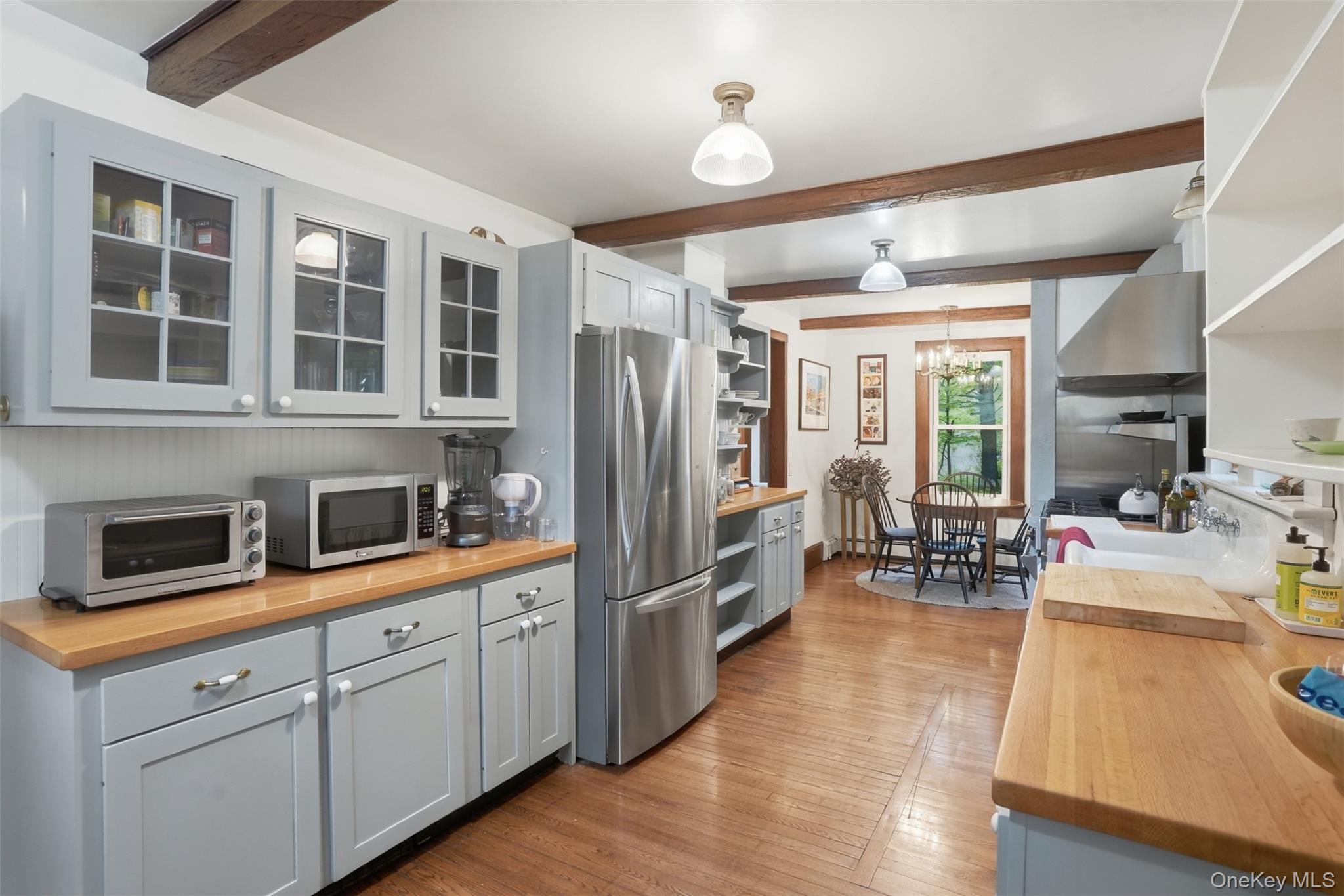 726 Wittenberg Road Mount Tremper, NY 12457 - Photo 11 of 32 a kitchen with stainless steel appliances granite countertop a refrigerator a stove a sink dishwasher a oven with wooden cabinets and wooden floor