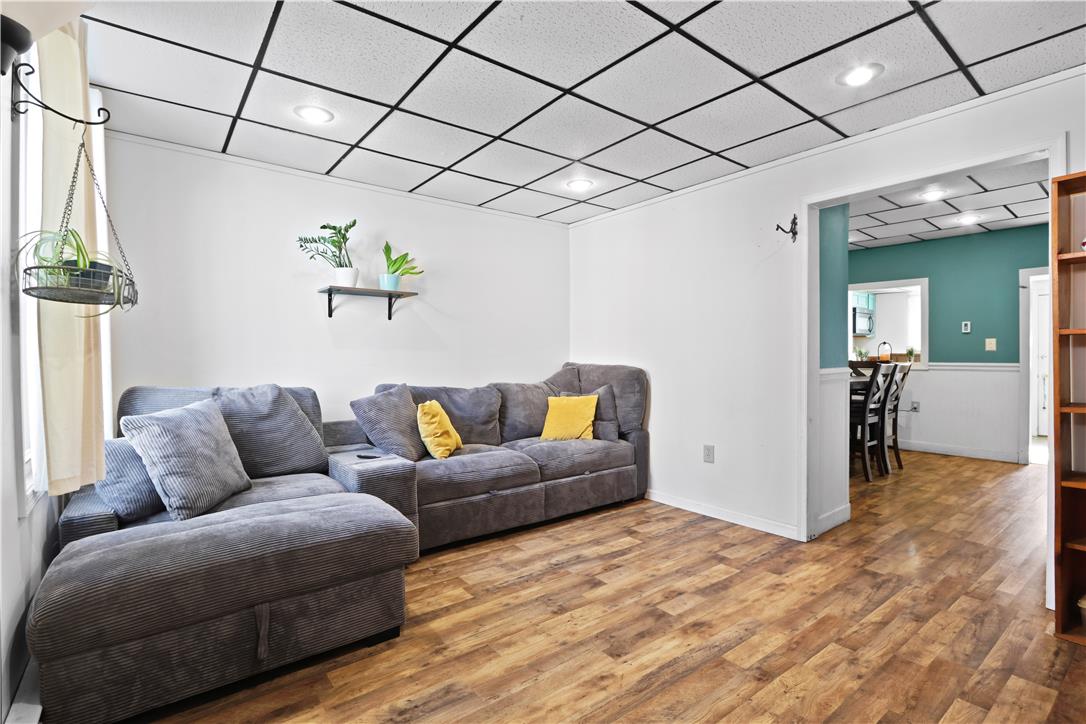 431 Pierce Street Bethlehem, PA 18015 - Photo 4 of 27 Warm wood-look flooring extends throughout this versatile living space, perfect for everyday relaxation and entertaining.