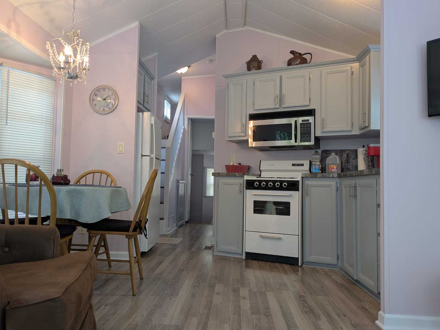 96 Fossil Ridge Road Wilmington, IL 60481 - Photo 3 of 22 a kitchen with stainless steel appliances a stove a microwave a refrigerator and cabinets