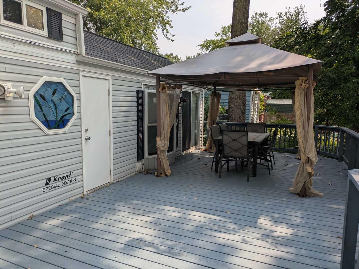 96 Fossil Ridge Road Wilmington, IL 60481 - Photo 10 of 22 a view of a dinning table and chairs in the roof deck