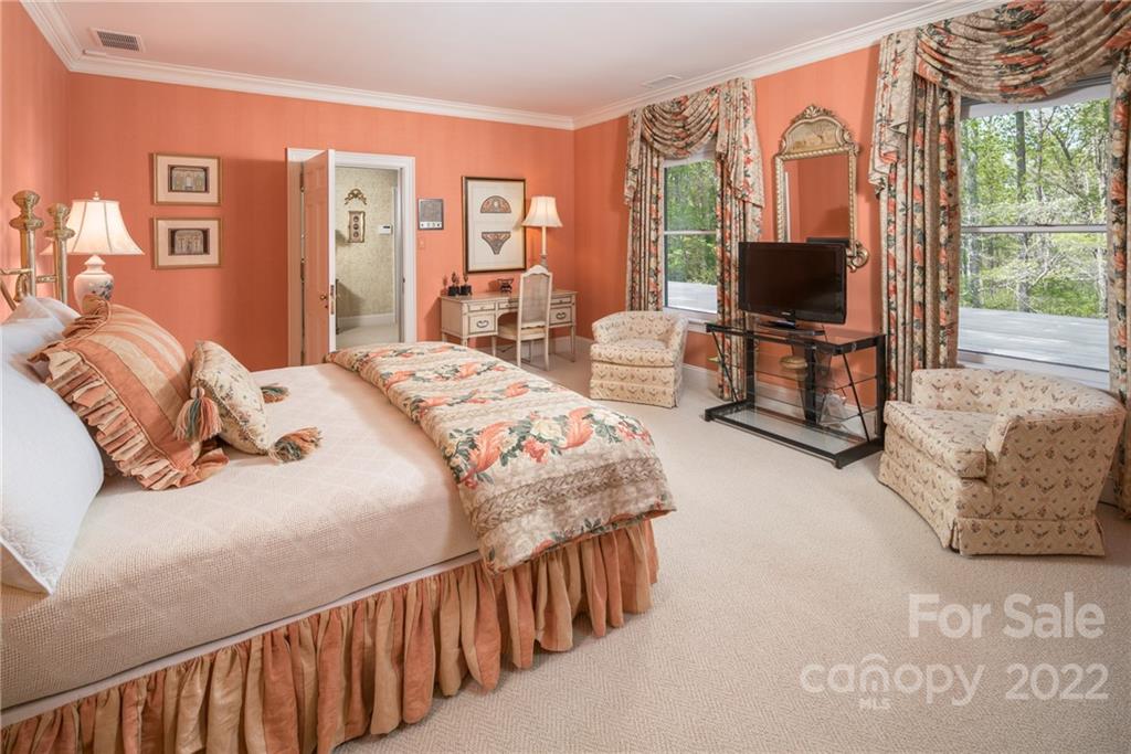 3394 Sandy Ford Road Newton, NC 28658 - Photo 20 of 43 a bedroom with a bed and a flat screen tv