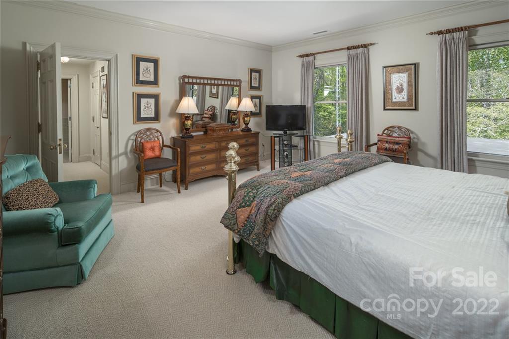 3394 Sandy Ford Road Newton, NC 28658 - Photo 21 of 43 a bedroom with a bed couch tv and window
