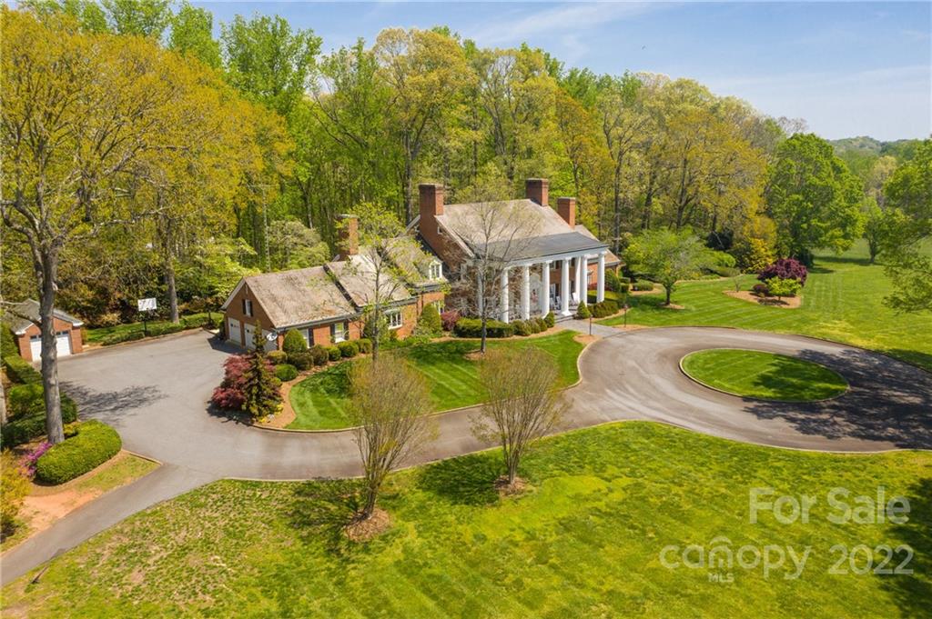 3394 Sandy Ford Road Newton, NC 28658 - Photo 39 of 43 an aerial view of a house with swimming pool and mountain view