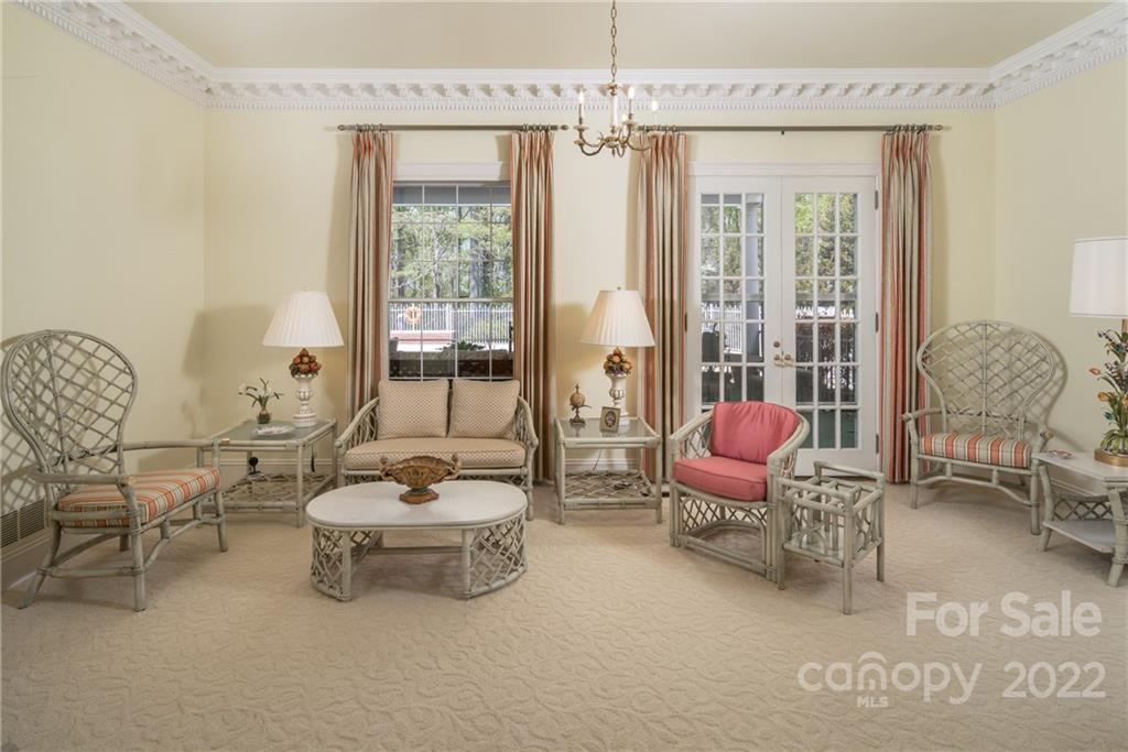 3394 Sandy Ford Road Newton, NC 28658 - Photo 8 of 43 a living room with furniture and a chandelier