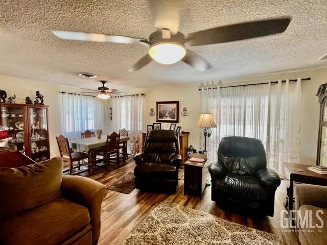 Undisclosed Address Bakersfield, CA 93306 - Photo 12 of 25 a living room with furniture and a chandelier