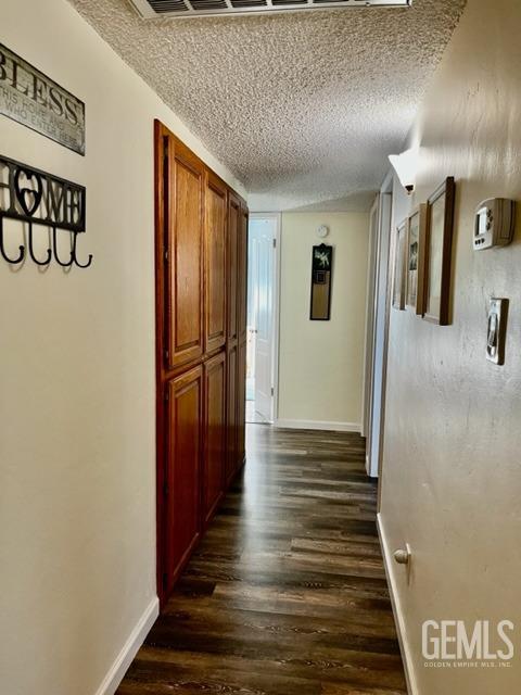 Undisclosed Address Bakersfield, CA 93306 - Photo 13 of 25 a view of a hallway with wooden floor and staircase