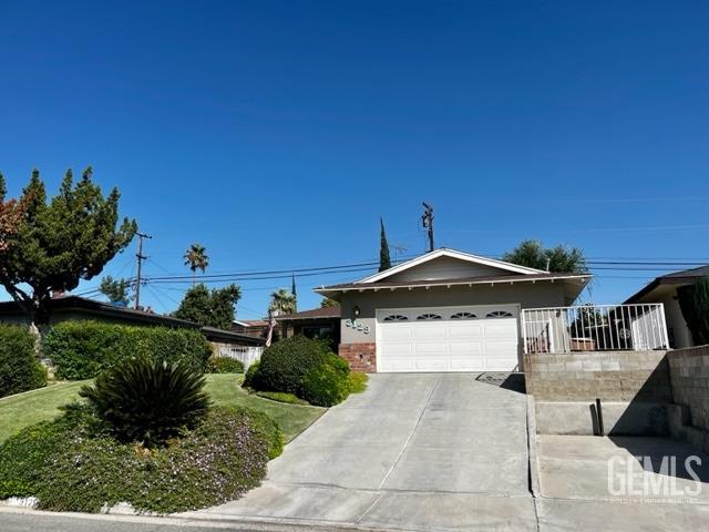 Undisclosed Address Bakersfield, CA 93306 - Photo 2 of 25 a front view of a house with a yard