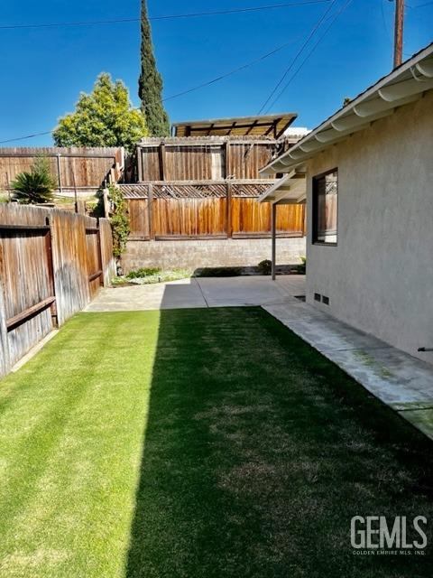 Undisclosed Address Bakersfield, CA 93306 - Photo 21 of 25 a view of a house with a backyard