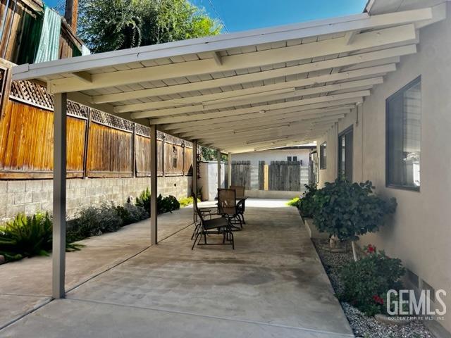 Undisclosed Address Bakersfield, CA 93306 - Photo 23 of 25 a view of a patio with couches table and chairs and potted plants