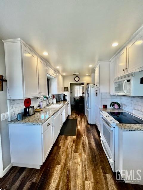 Undisclosed Address Bakersfield, CA 93306 - Photo 5 of 25 a kitchen with kitchen island granite countertop lots of counter top space and stainless steel appliances